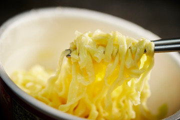 Instant noodle, eating with chopsticks 