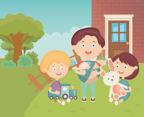 Obraz na płótnie Canvas kids with train ball and rabbit in the grass backyard, toys