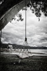 lonely swing on a rainy day