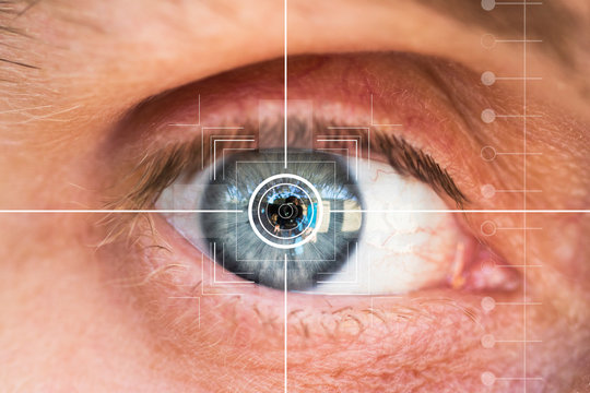 Eye monitoring and treatment in healthcare. Biometric scan of male eye closeup.