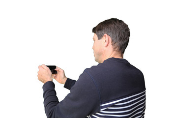 Naklejka premium Man takes pictures with his cellphone (white background)
