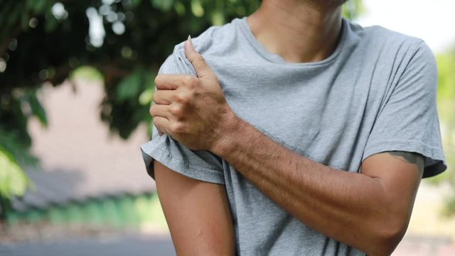 Shoulder Injuries, young man with pain in shoulder, Ache in human body , office syndrome , health care concept