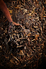 Chinese Pu'er tea leaves with spoon