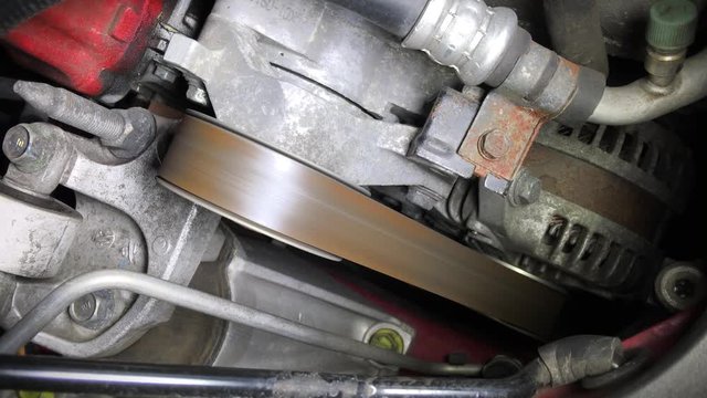 fan belt of a running engine car
