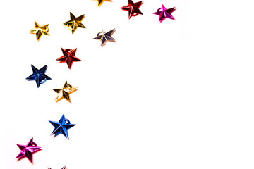 Christmas composition. Colorful stars decorations on white background. Christmas, winter, new year concept. copy space