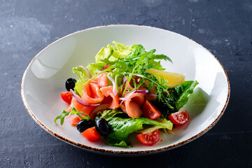 Smoked salmon salad in dash close up.