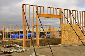 Wood frame work of new commercial building under construction.