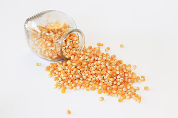  Corn kernels in a jar on a white background