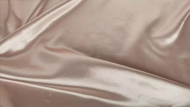 beautiful silk fabric of a delicate cream color draped with small folds, soft flowing, luxurious, wedding concept, texture, background, card form, copy space