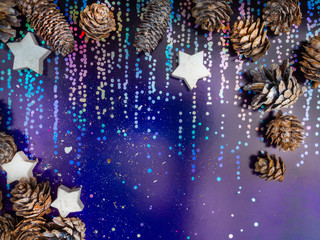 Photo of magic holographic rainbow colors, colorful iridescent surface. Holiday concept with cones...