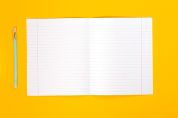 White note on yellow background. Flat lay, copy space.