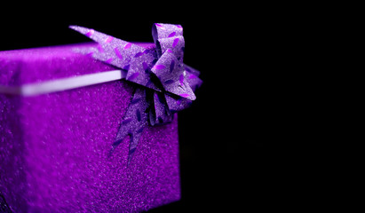 Christmas holidays gift box on black background with copy space for your text