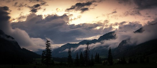 Plakat Panorama of summer evening in Altai mountains with fog, Russia,