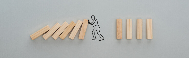 panoramic shot of drawn man pushing wooden blocks on grey background, business concept