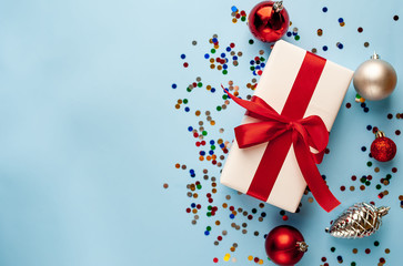 Christmas card, Christmas present with toys on a blue background, top view with place for congratulation