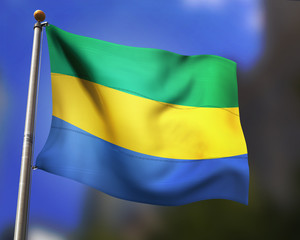 Gabon flag waving in blue sky