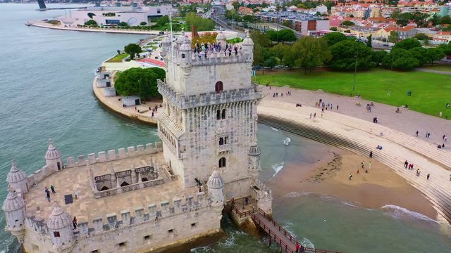 Belem Tower in Lisbon is a famous landmark in the city - aerial drone footage