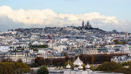 Aerial photo of Montmartre with Sacre Coeur Basilica against clouds