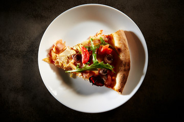 A piece of pizza on plate 