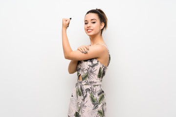 Young woman over isolated white background doing strong gesture