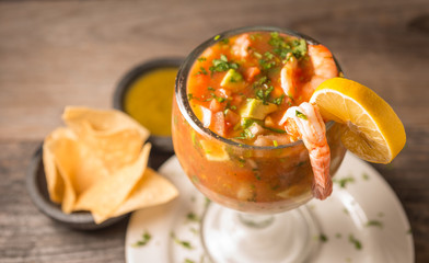 Michelada con camarones served with tortilla chips and salsa.