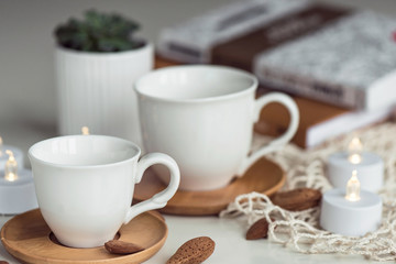 Fototapeta na wymiar Composition with white coffee tea white cups
