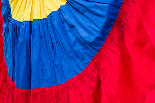 Palenquera, fruit seller, dress in the colors of Colombian flag