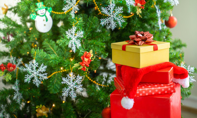 Gift boxes and Beautiful Christmas tree with festive decor on bokeh background. Space for text. Holidays,Festive background, congratulation, copy space,gifts, background,copy space,place for text.