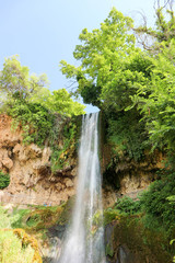 Fototapeta na wymiar Scenic view of famous Edessa waterfall surrounded by green trees, Greece
