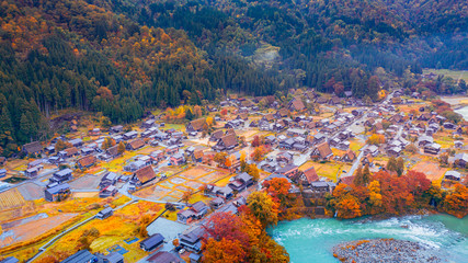 The traditionally thatched houses in Shirakawa-go where is the mountain village among near Gifu,...