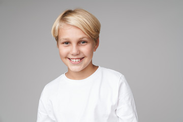 Cheery blonde boy child posing isolated © Drobot Dean