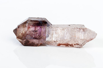 macro mineral stone Amethyst on smoky quartz on a white background
