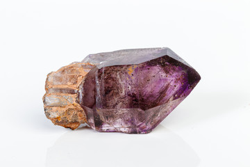 macro mineral stone Amethyst on smoky quartz on a white background