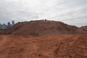 Earthwork gravel space background view stacked into hills