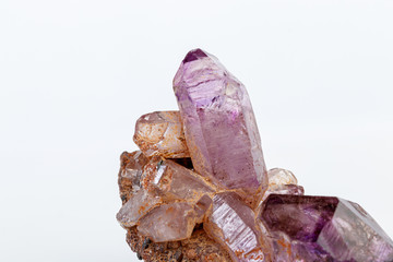 macro mineral stone Amethyst on smoky quartz on a white background