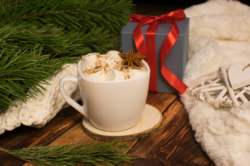 Cup of coffee and christmas presents.