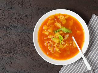 Tomato fish soup with celery. Mediterranean soup. Tunisian soup.