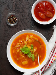 Tomato fish soup with celery. Mediterranean soup. Tunisian soup.