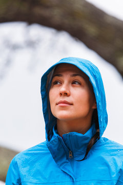 Close up shots of a woman exploring an old toppled live oak tree in the shallow waters of Roanoke Sound during a rainy day on the western edge of the Nags Head Woods Preserve near the dead end on the southern stretch of the Old Nags Head Woods Road.