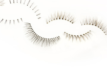 fake false eye lashes on white background 