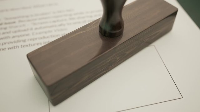 An important document being approved by green office stamp in slow motion. 4KHD