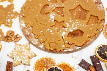 Making christmas gingerbread cookies. Raw dough in shape of gingerbread man,christmas tree, star,