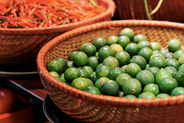 Limes in wicker basket at the market