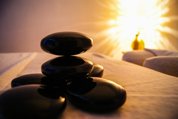 Professional massage relaxation lights and hot stones with coconut oil