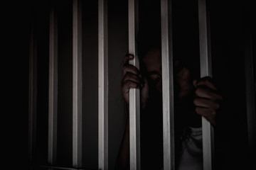 Hands of women desperate to catch the iron prison,prisoner concept,thailand people,Hope to be...