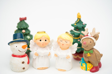 Christmas caroling or Carolers singing with snowman and reindeer on white background.Angel group singing carol song on celebration of christmas season in winter time.Chorus singing worship concept.