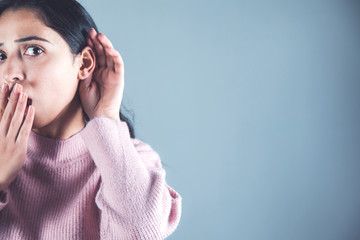 surprised woman hand in ear
