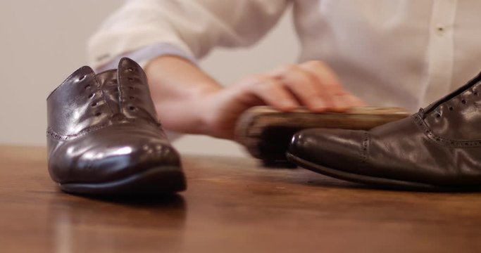Old Parisian brown color leather shoes being polished. shining shoes is an important part of gentleman life.