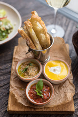 Assorted Appetizers and Wine. Roasted Aubergine Dip, Tomato Basil Sauce and Cream Cheese with Fruit