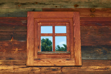 Obraz na płótnie Canvas Window of a wooden cottage